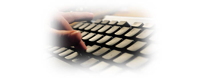 Hands typing on a keyboard — AI-powered OCR automation